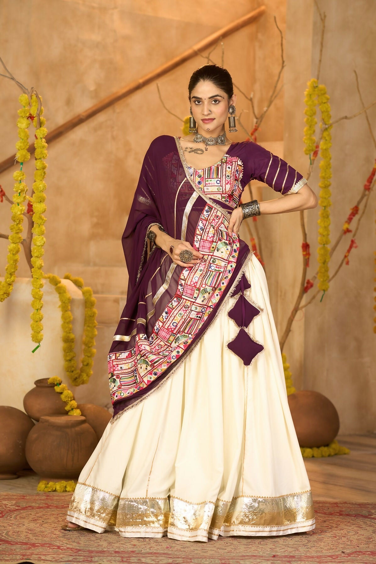 Off white crepe lehenga with wine blouse and dupatta for Navratri