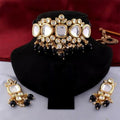 A sophisticated handcrafted black Kundan necklace set featuring gold plating and an adjustable cord.