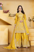 A beautiful yellow crepe kurti with intricate embroidery paired with matching sharara pants.