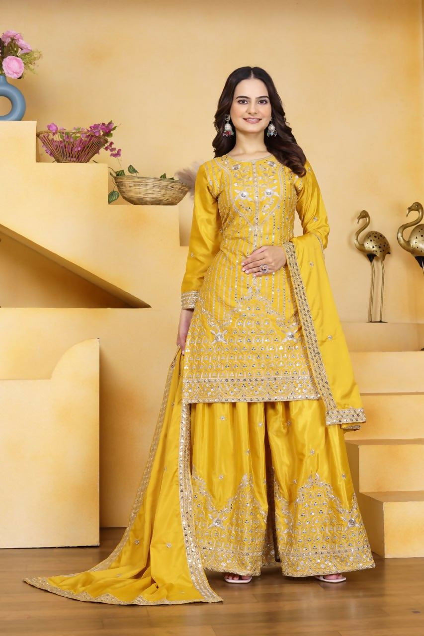 A beautiful yellow crepe kurti with intricate embroidery paired with matching sharara pants.