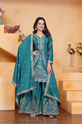 A stylish teal crepe kurti paired with matching embroidered sharara pants