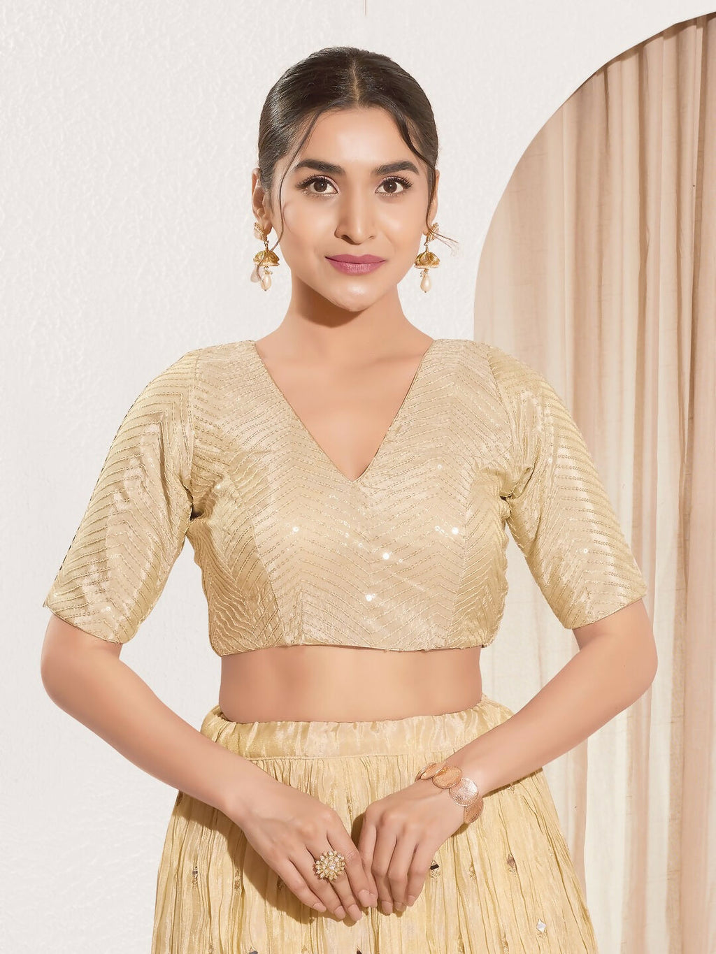Gold sequin embroidered padded blouse with V-neck and elbow sleeves