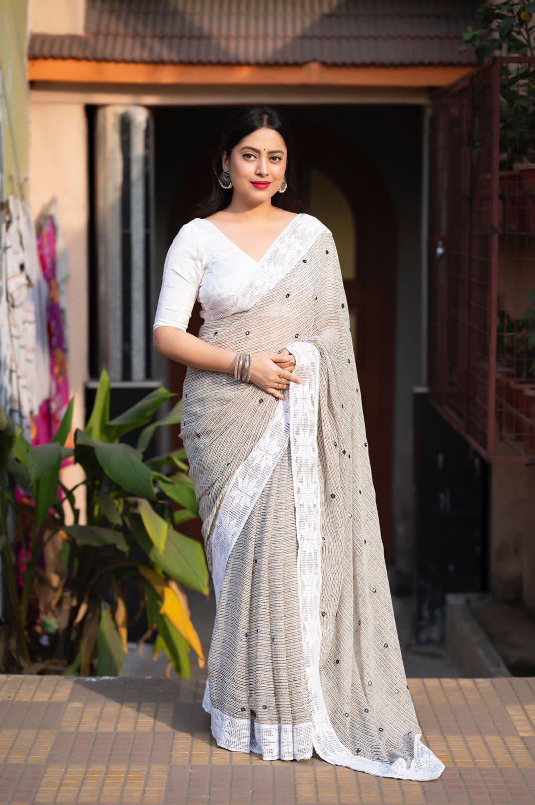 Grey poly georgette saree with Aari mirror work border and self-woven blouse