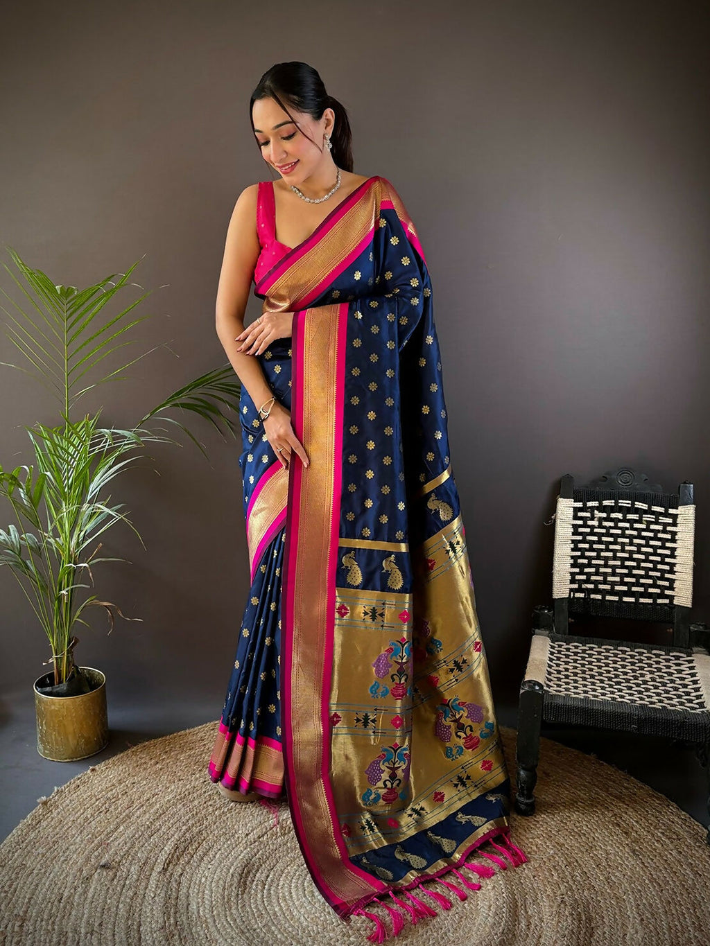 Pink Kanchipuram-style silk saree featuring small Butti woven motifs