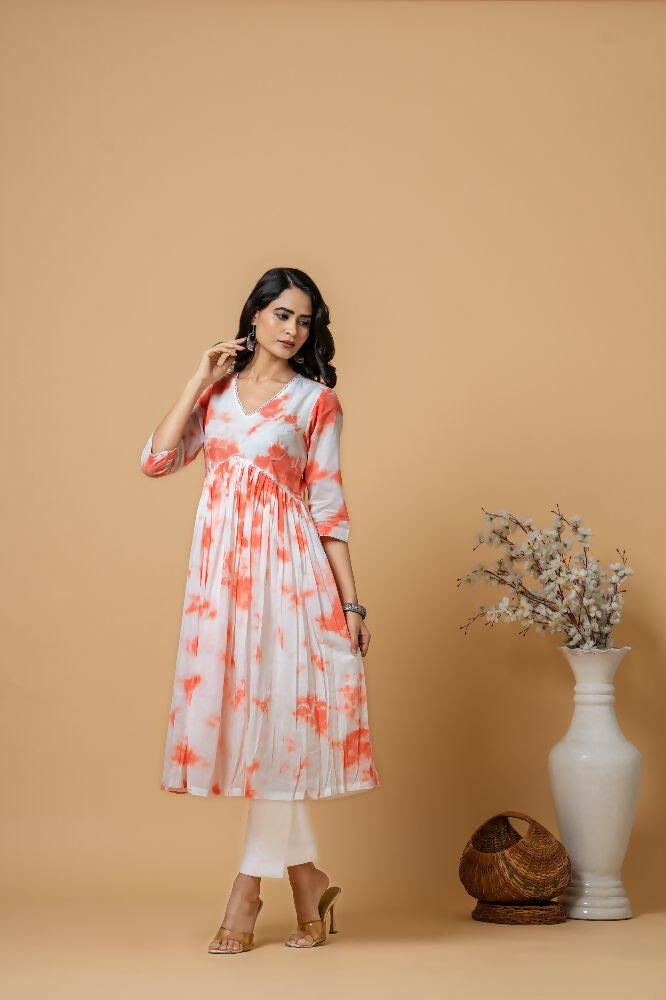 Woman wearing a peach tie and dye cotton kurta pant set from Joban Fashion