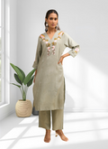Pista Green linen cord set with V-neckline and intricate embroidery for festive occasions