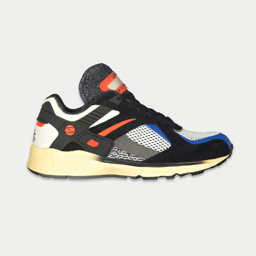 LA Gear Catapult lowtop sneaker in black and orange colorway with light-up sole detail