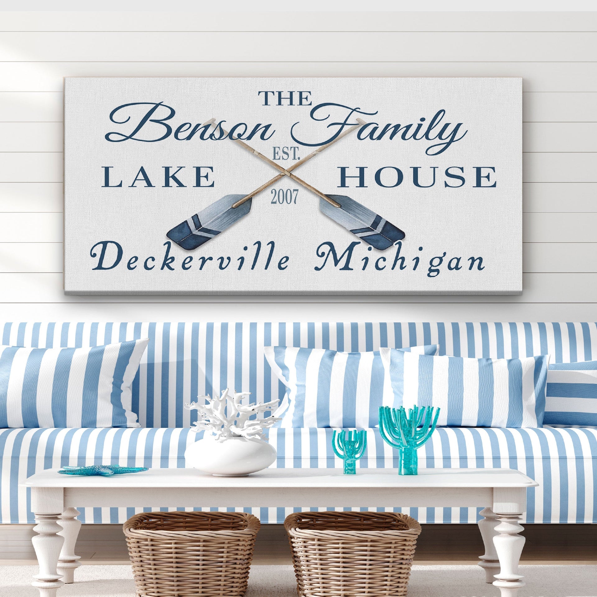 Personalized nautical coordinates sign featuring crossed rustic oars and paddles on a wooden wall