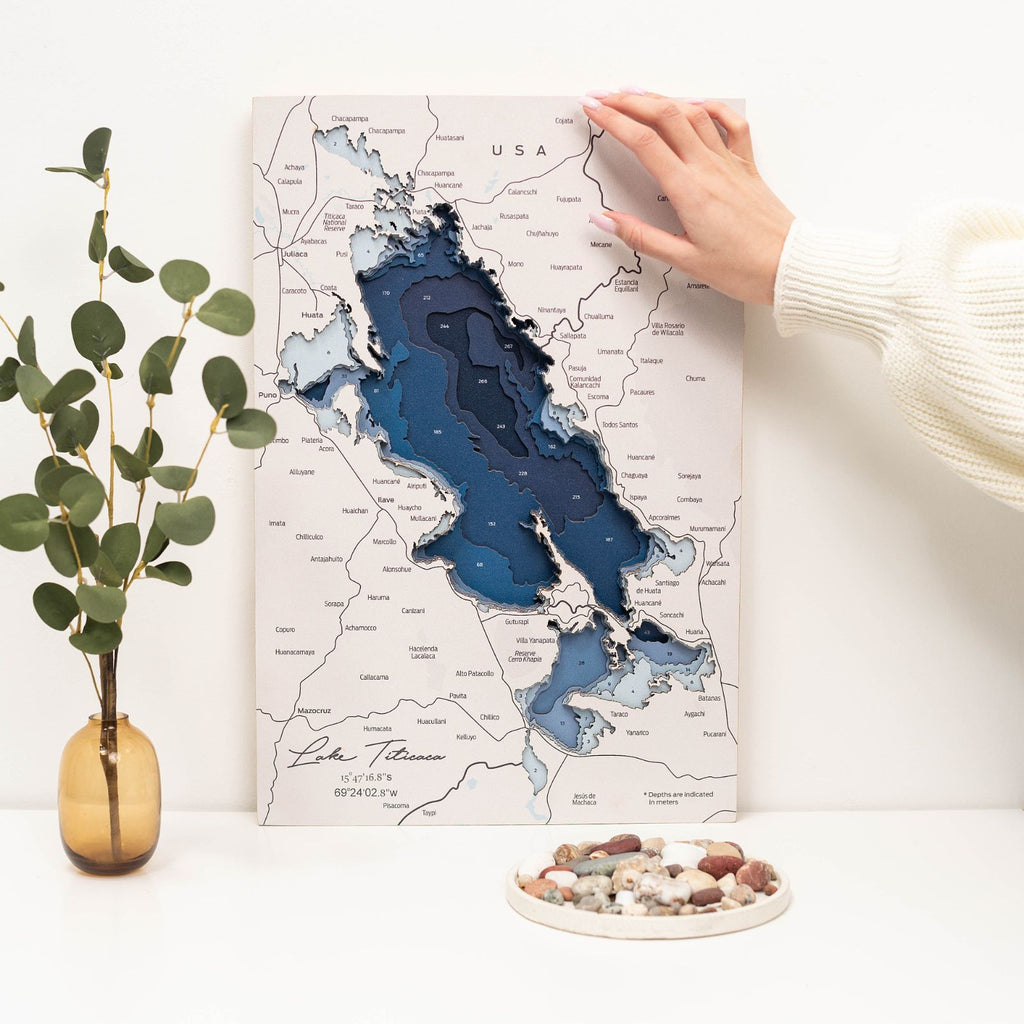 Intricately detailed Lake Titicaca wooden map wall art in blue, white, and natural wood tones
