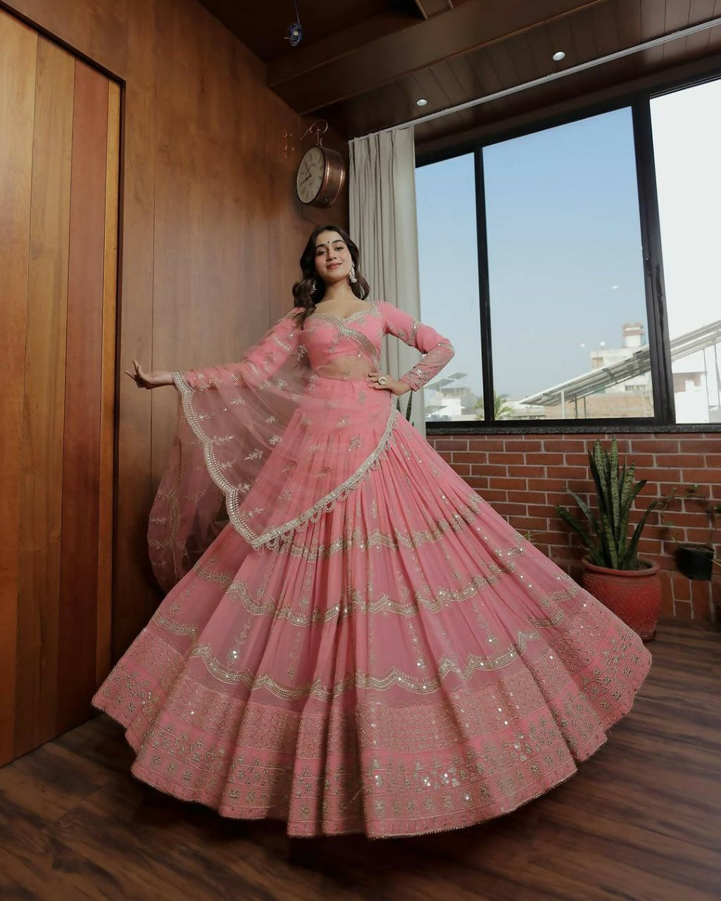 A designer baby pink lehenga choli set with 5MM sequins and zari embroidery in faux georgette fabric.