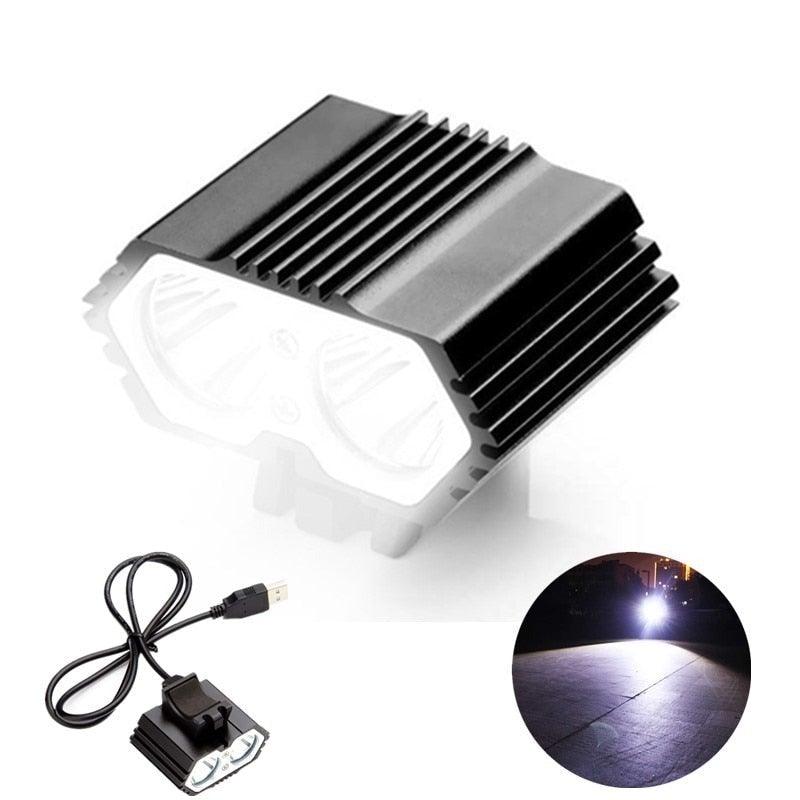 A matte black industrial LED bicycle headlight with silver reflectors and a compact, modern design.