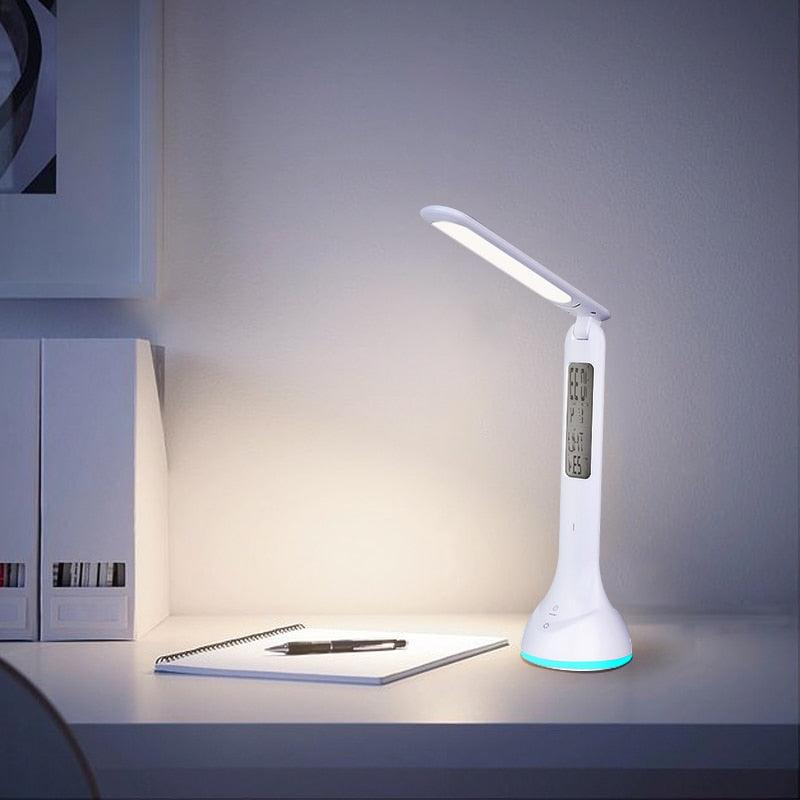 Modern white foldable LED desk lamp with LCD clock and RGB color light
