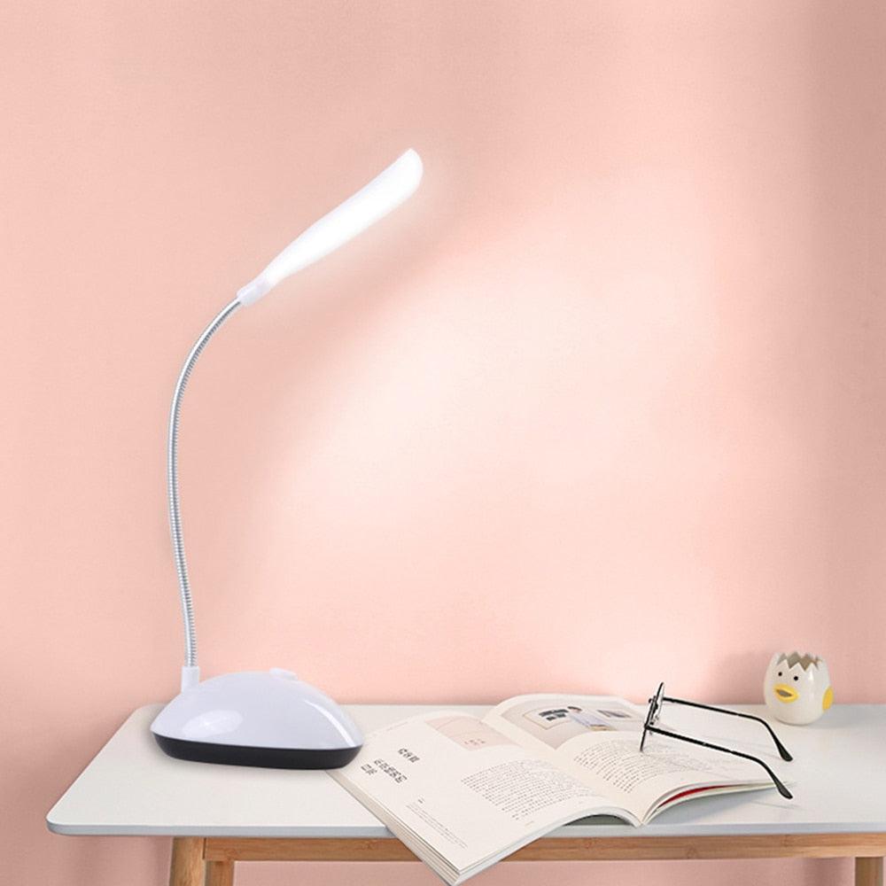 Flexible black and white LED desk lamp with 360-degree rotation capability