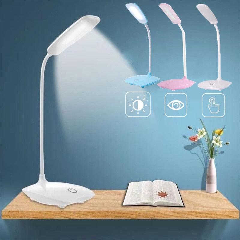Modern white LED touch reading lamp with 3-speed dimming and USB charging port on a wooden desk.