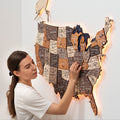 Multicolor wooden 3D LED USA map wall art with geometric design in brown, white, and orange.