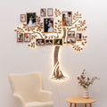 Wooden LED Family Tree wall art with soft warm glowing lights on a living room wall