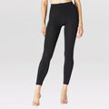 Model wearing black slim fleece-lined base layer leggings with 300 denier thickness