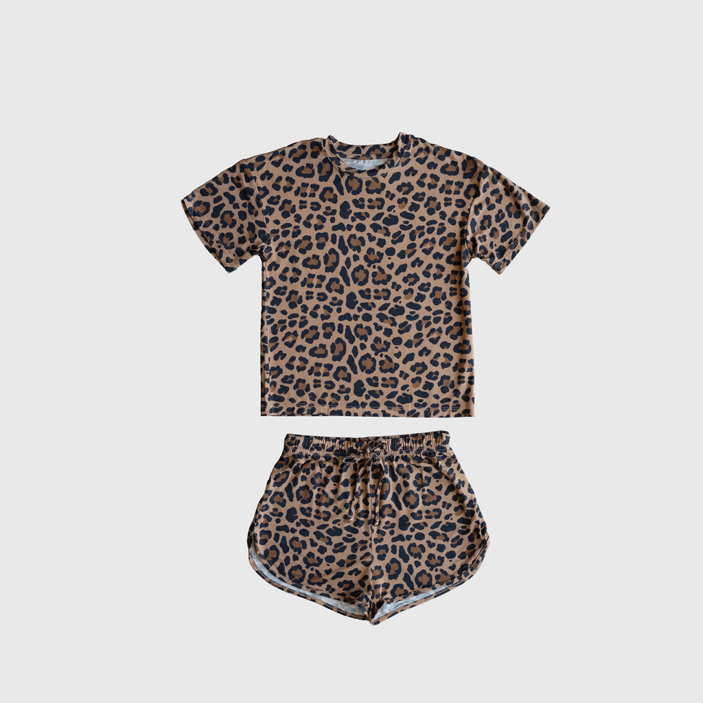 Girl wearing a leopard print bamboo short set with a drawstring waistband