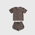 Girl wearing a leopard print bamboo short set with a drawstring waistband