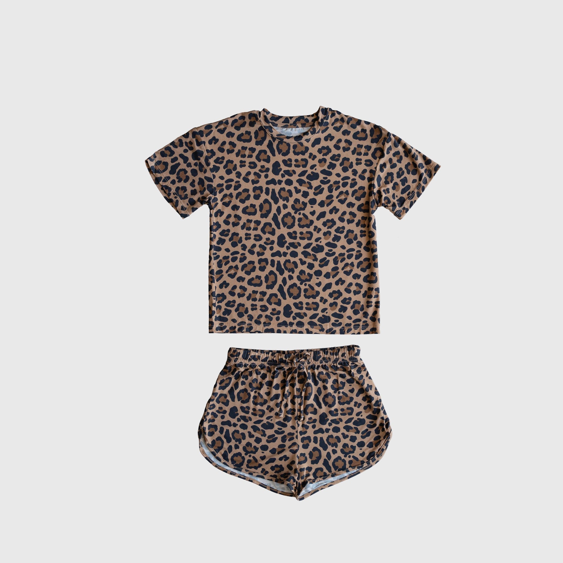 Girl wearing a leopard print bamboo short set with a drawstring waistband