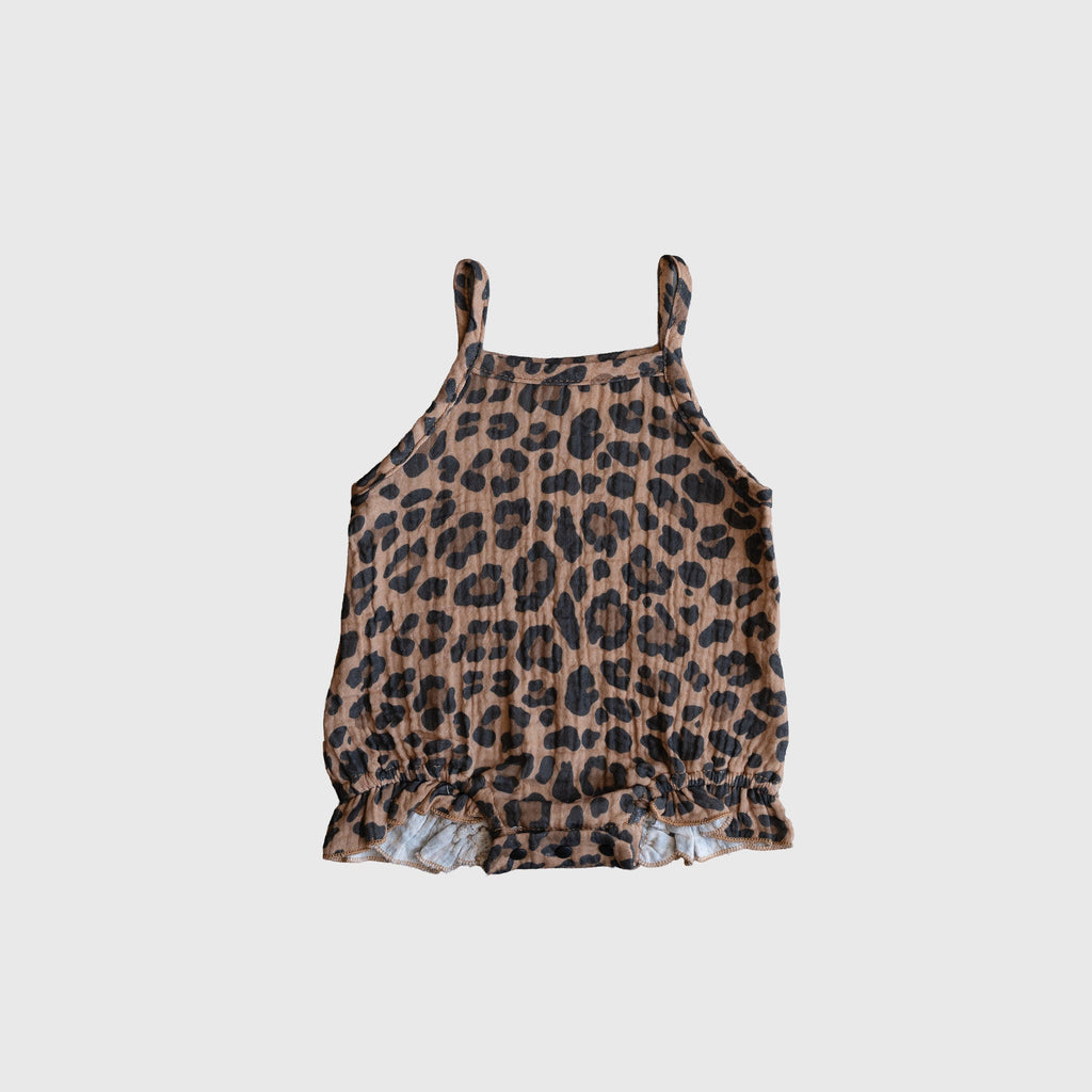 Baby wearing a leopard print muslin sleeveless tank romper with a relaxed fit.