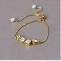 A gold-polished brass Kundan bracelet featuring intricate traditional detailing.