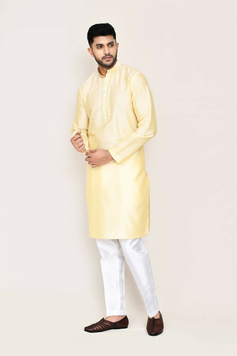 Elegant cream colored art silk kurta set featuring a straight-fit pant design.
