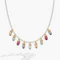 Close up of a Christmas light bulb necklace with clear beads and muted resin accents.