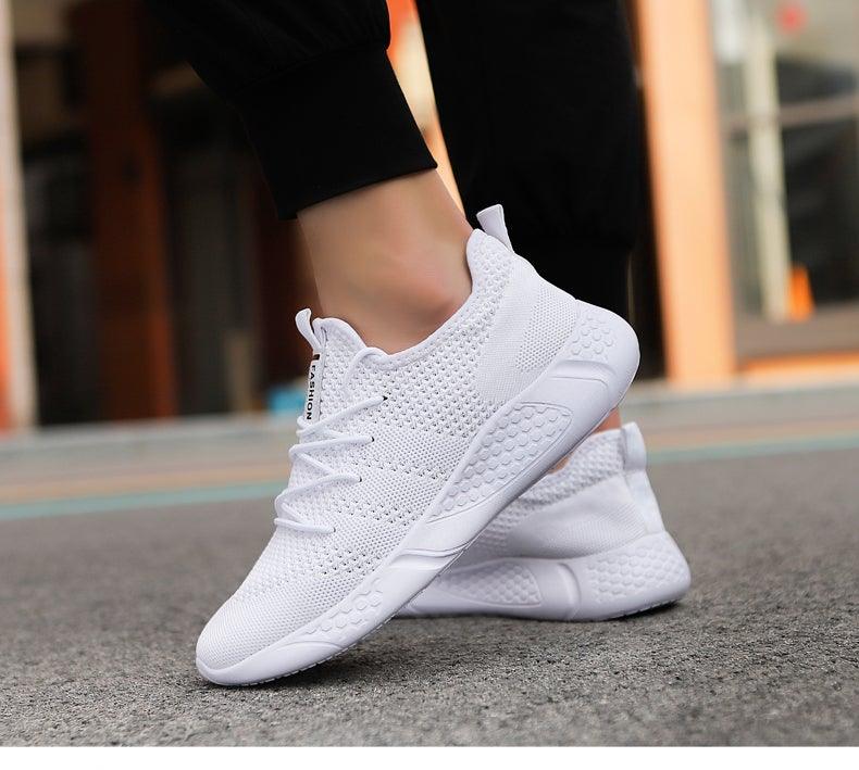 Men's white and black athletic knit sneakers with anti-skid rubber and EVA soles.