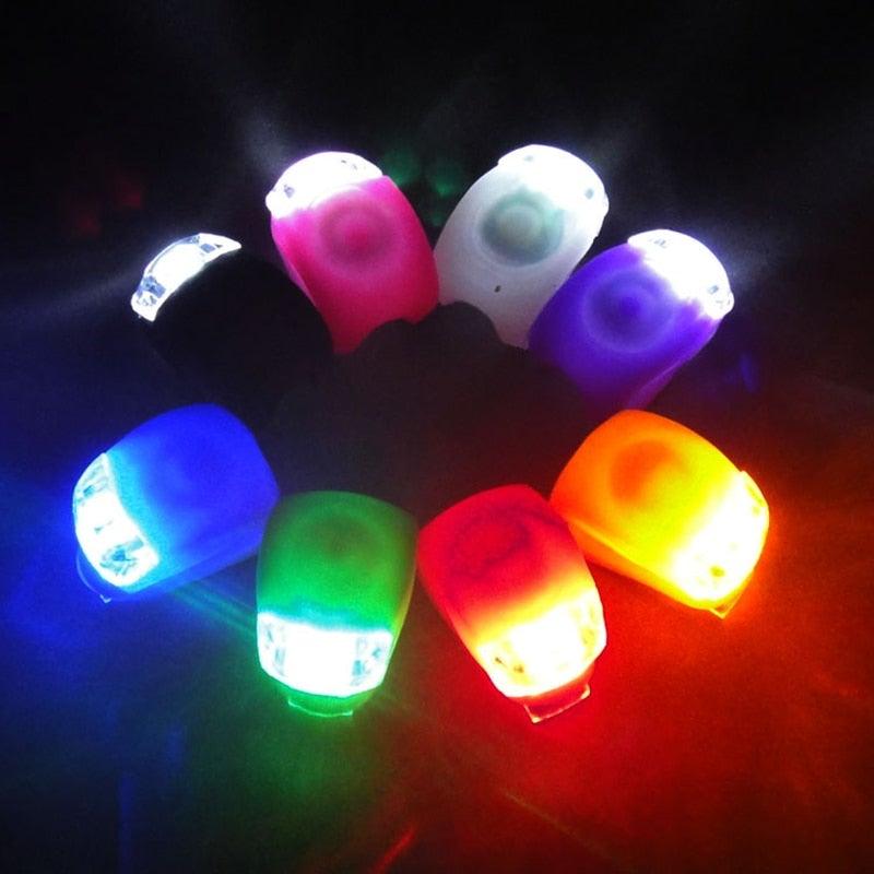 Compact silicone LED bicycle front and rear lights for enhanced cycling safety.