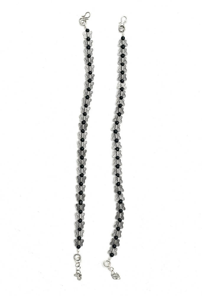 A pair of traditional oxidised silver butterfly anklets for women