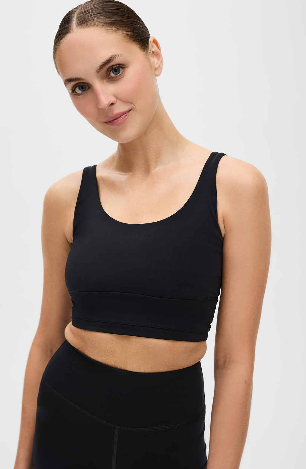 Black Lisse compression bra with a long-line silhouette and minimalist design.
