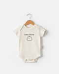 Off-white and black Baby Chick minimalist onesie with Scandi-style print