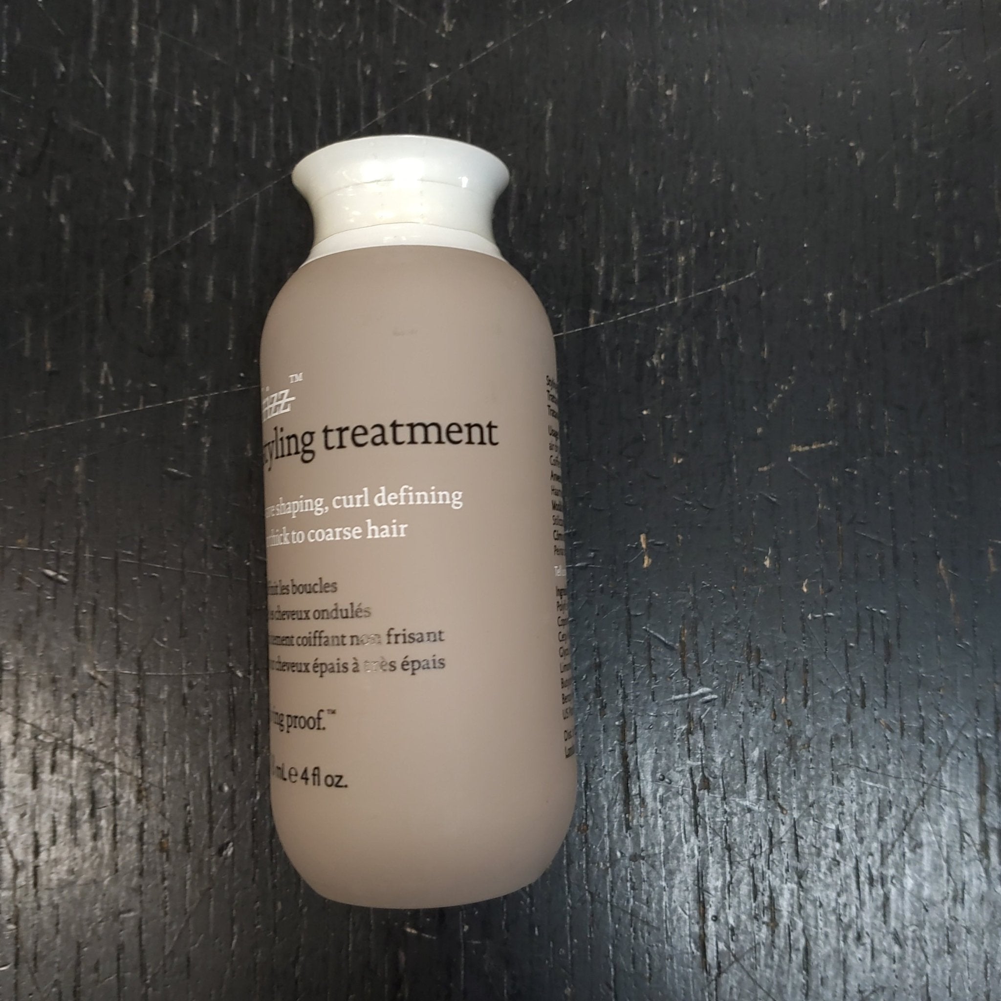 Beige and white bottle of Living Proof No Frizz Wave Shaping, Curl Defining for Thick to Coarse Hair 4 fl oz