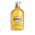 Bottle of L'Occitane Almond Shower Oil, 16.9 Oz, golden liquid in transparent bottle.