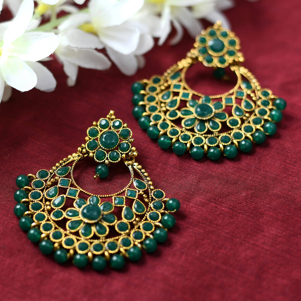 Stunning golden and green beaded earrings with intricate design.