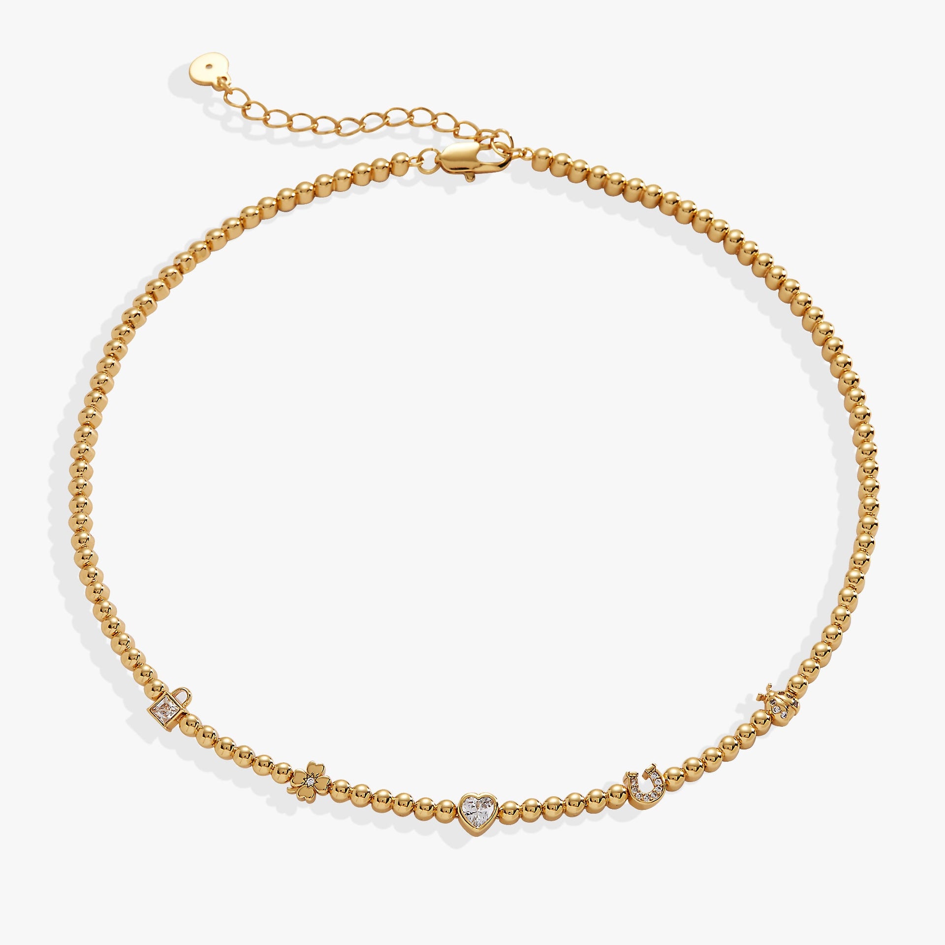 Close-up of the Love and Luck Tennis Necklace featuring symbolic charms and an adjustable beaded chain.