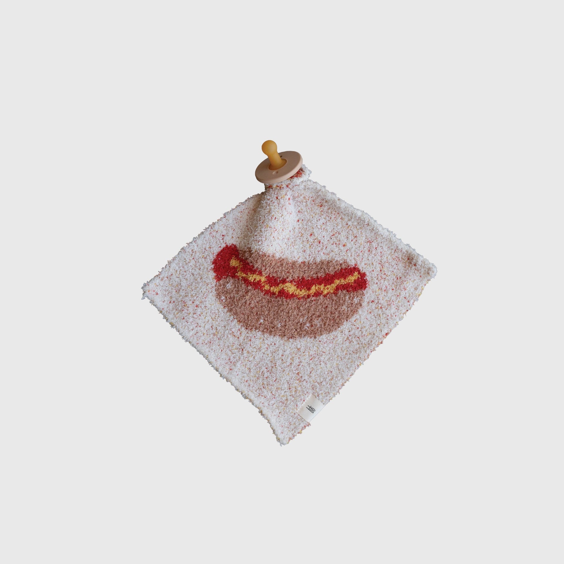 Soft knit baby lovey featuring a playful hot dog print on a cream background