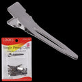 Close-up of silver LQQKS single prong metal hair clips for professional styling