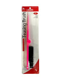 Professional hair teasing brush in pink and black for volume styling.