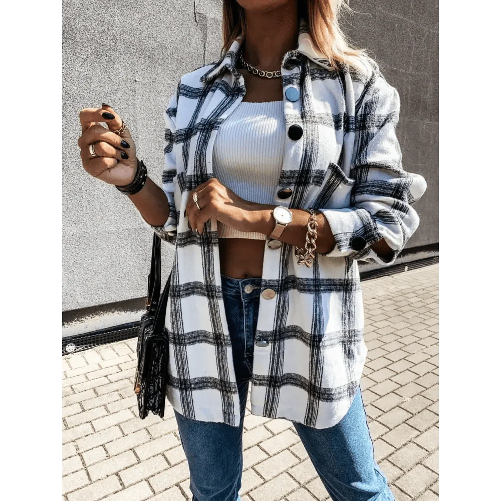 Women wearing an oversized plaid cotton blend button-down shirt coat in a casual street style outfit