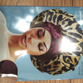 Woman wearing a luxurious satin tie bonnet in leopard print for hair protection.