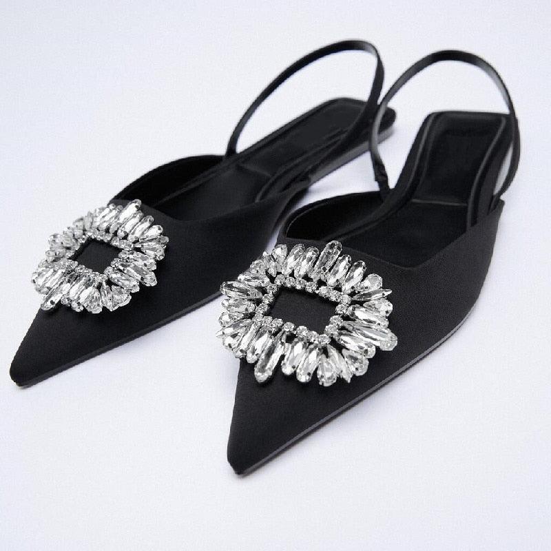 Black pointed toe flat mules with rhinestone straps and elastic band for women