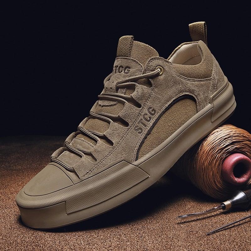 Modern luxury leather men's lace-up sneakers in tan, displayed in a casual urban lifestyle setting.