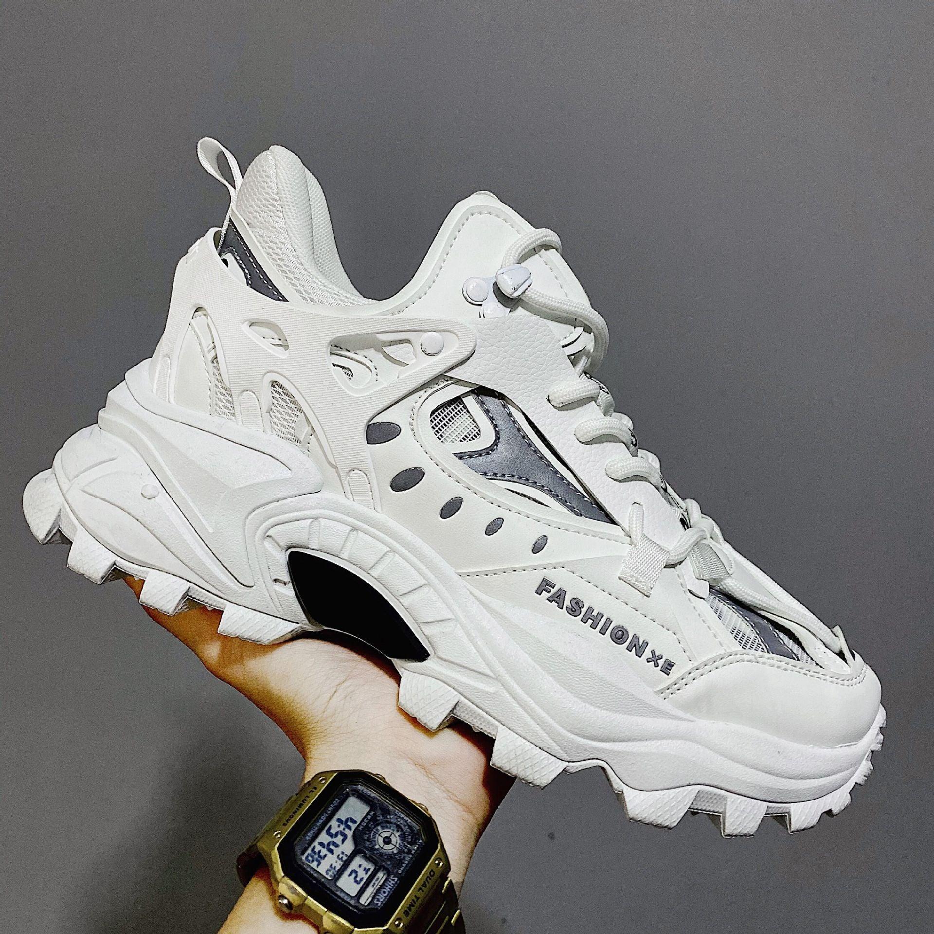 Luxury white high fashion men's sneakers with chunky rubber soles