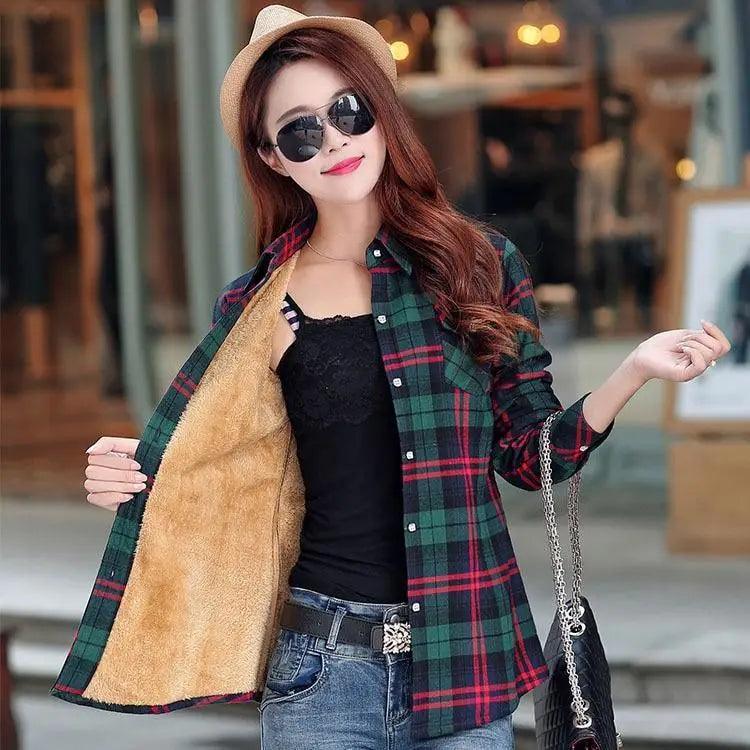 A woman wearing a luxury velvet-lined plaid shirt style jacket with a turn-down collar