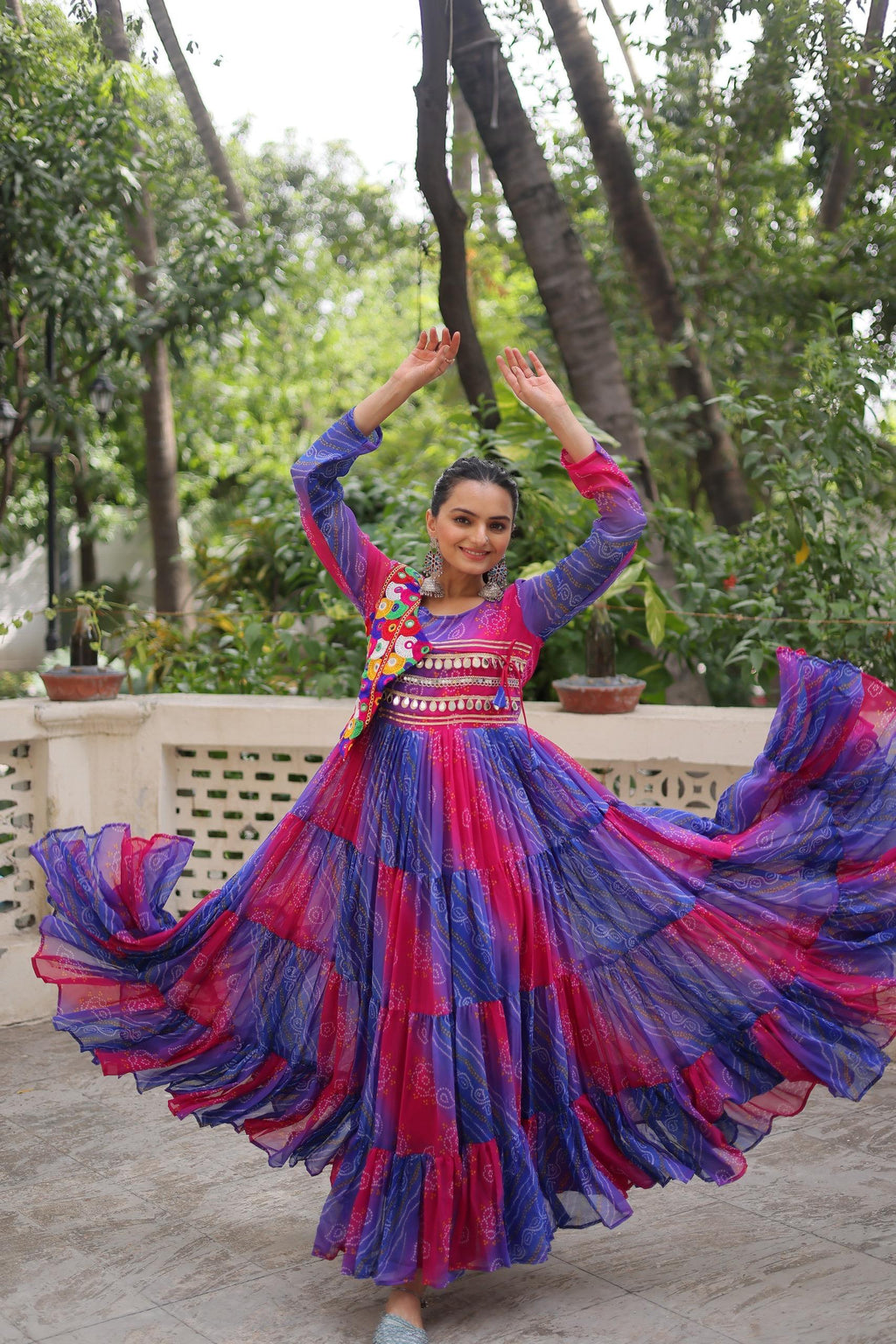 Blue faux georgette Navratri gown with Leheriya and Bandhej print and Kutchi patch work details