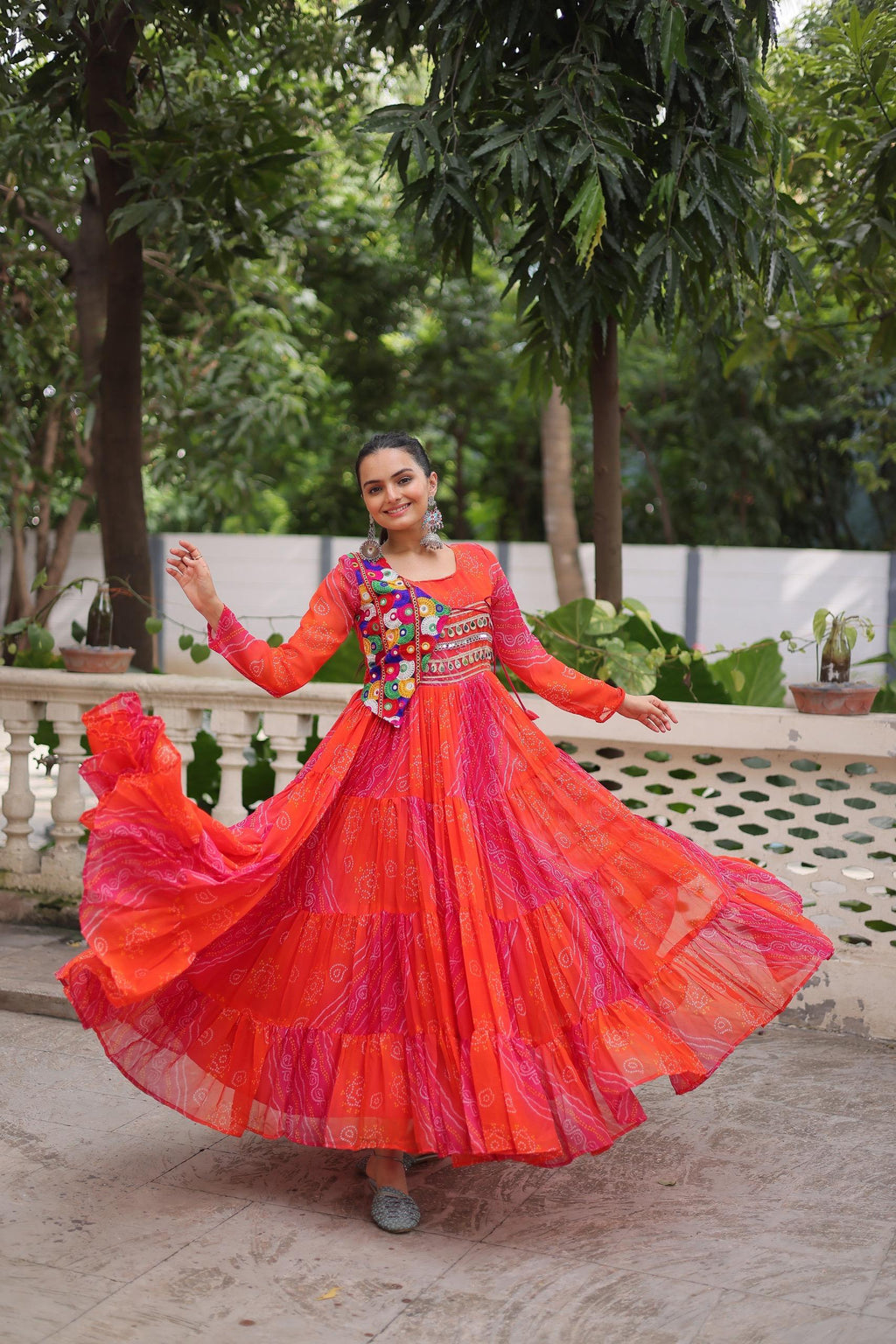 Red faux georgette Navratri gown with traditional Leheriya and Bandhej prints and Kutchi patch work
