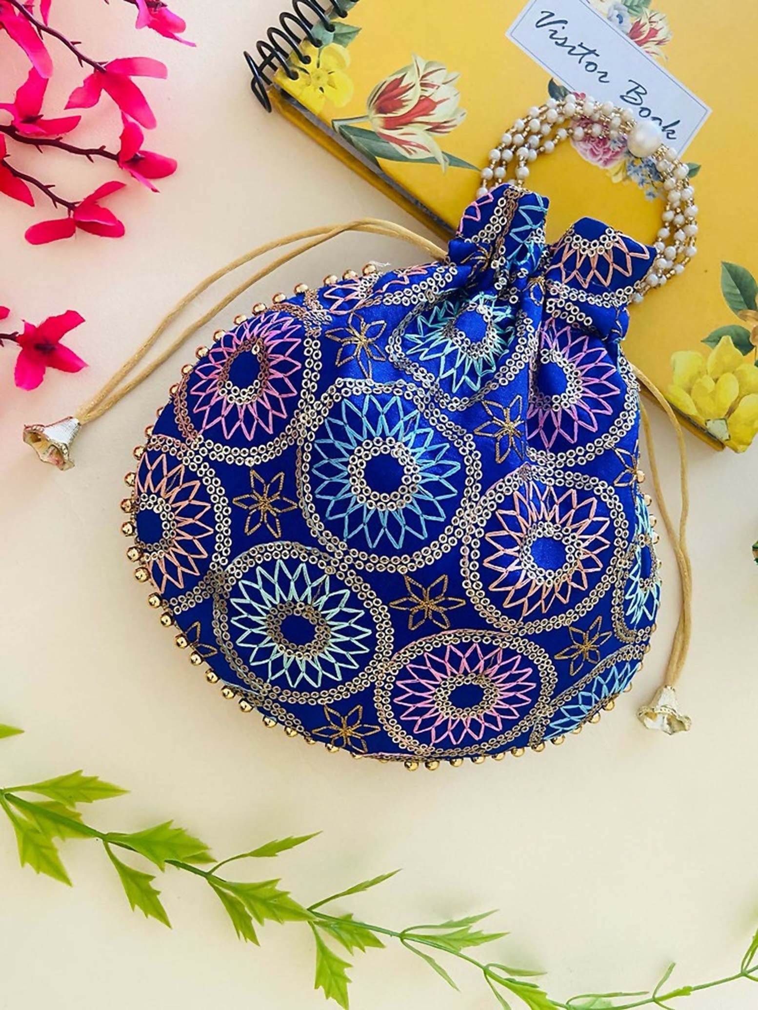 Elegant blue synthetic potli bag with drawstring closure for ethnic occasions