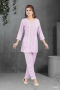 Model wearing a two-piece heavy muslin kurta set in lylac color with cotton lining